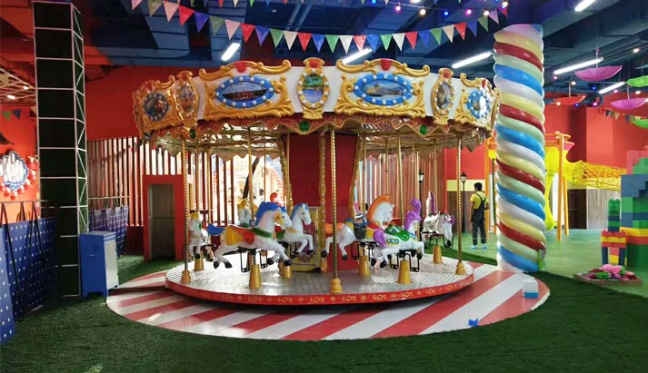 Indoor playground carousel ride 